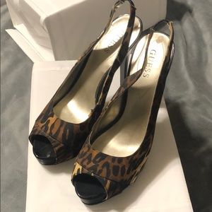Guess! Sling back heel with hidden platform.